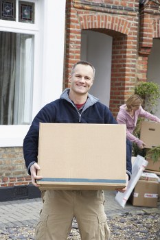 Professional removals in Millhill with packed moving boxes ready for transport
