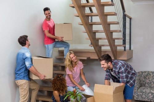 Man and van service moving boxes from a property