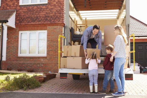 Furniture and boxes being moved into a Millhill flat