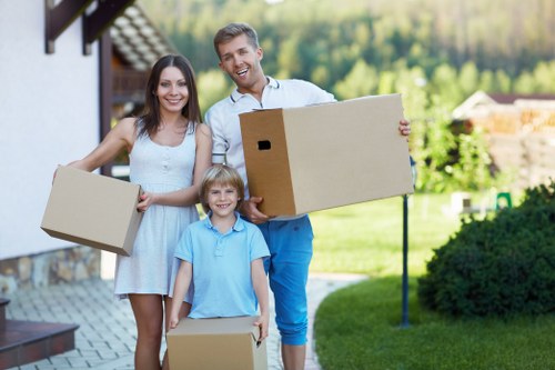 Experienced movers handling household items with care in Mill Hill