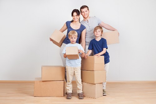 Local team collecting old sofas and chairs from a Mill Hill property