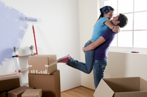 Careful unpacking service in Millhill organizing belongings in a new property