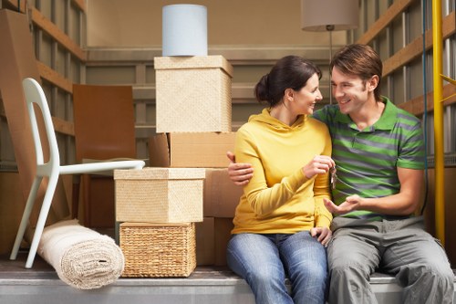 Careful dismantling of large furniture during a Millhill move